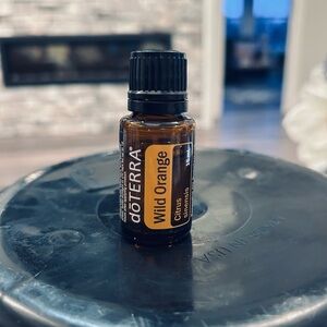 Doterra Wild Orange Bottle with Yellow Label and Black Cap